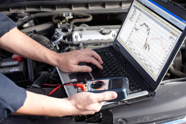 dreamstime_m_35581662 Professional car mechanic working in auto repair service.